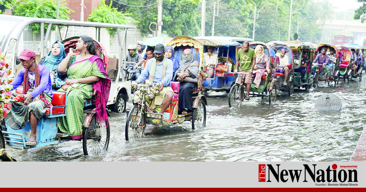 Gridlock grips the capital as hundreds of vehicles sit motionless near Dhaka University on Monday as heavy rain and poor traffic management bringing the city to a standstill. Photo: Shamim Ahmed
